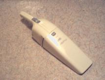 A small, hand-held vacuum cleaner